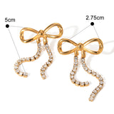 Orecchini Fiocco Dorato con Zirconi Pendenti - Mystic Bow